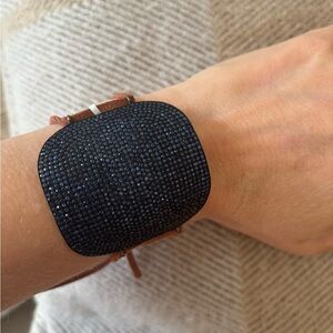 Sapphire Jenefer miller bracelet with leather band with diamond clasp to close.